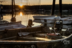 Sunrise Over Moored Rowboats